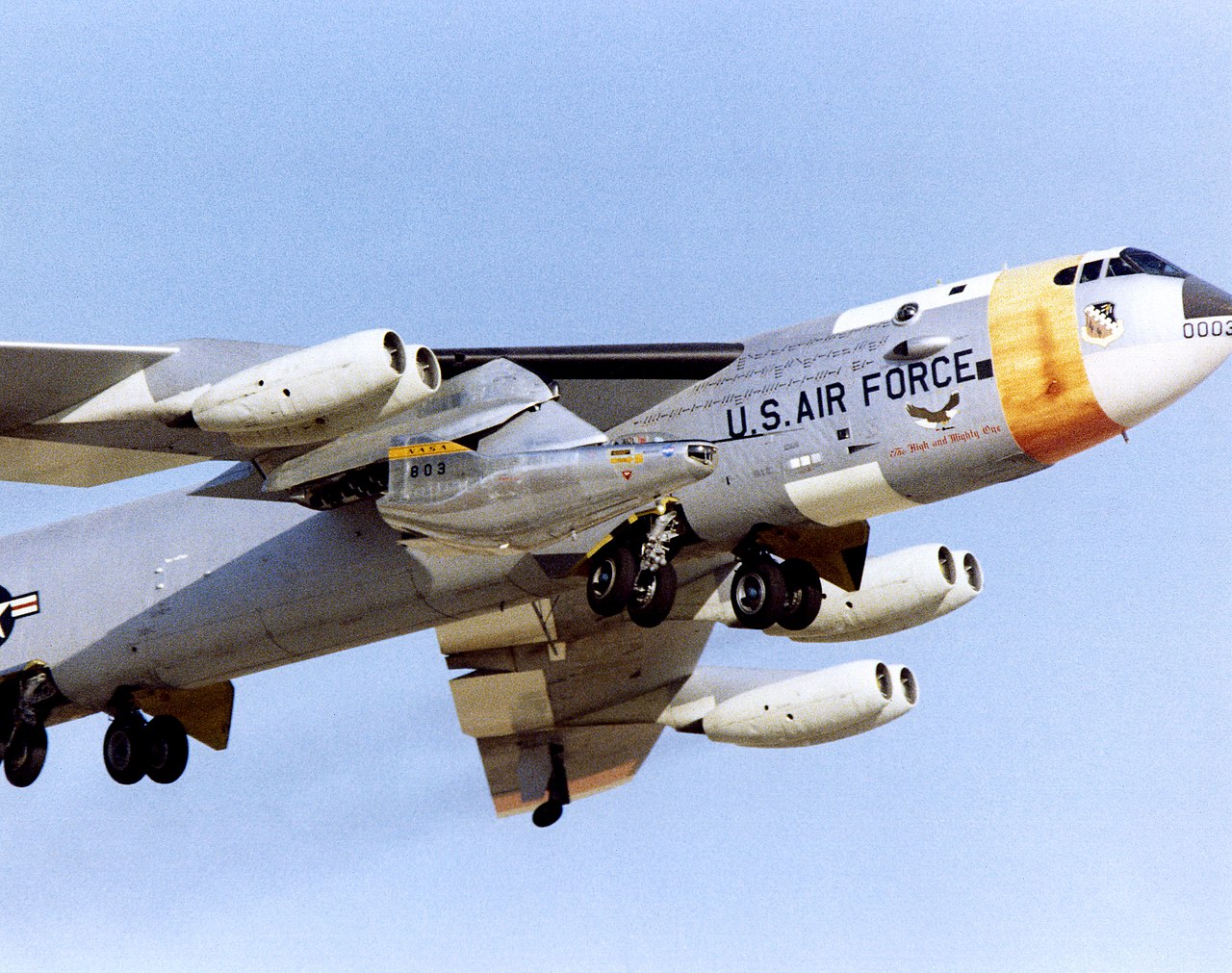 M2-F2 lifting body carried aloft under the wing of a NASA B-52 mothership