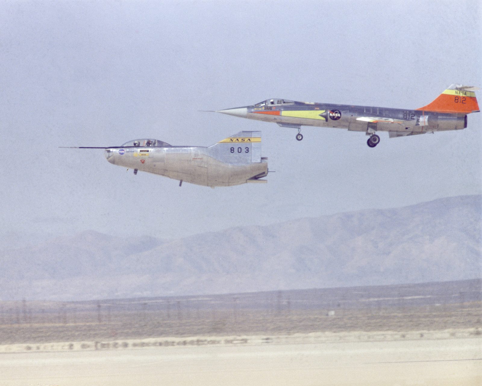 M2-F2 landing on Rogers Dry Lake with an F-104 chase plane
